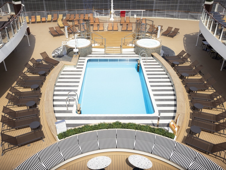 Straight-on view, from above, of Queen Anne's Panorama Pool Club, showing deck pool, whirlpools, deckchairs and view from the ships' aft