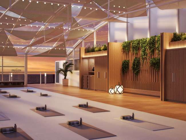 Queen Anne's wellness studio (render) at dusk, showing spacious room with yoga mats