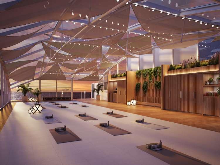 Queen Anne's wellness studio (render) at dusk, showing spacious room with yoga mats